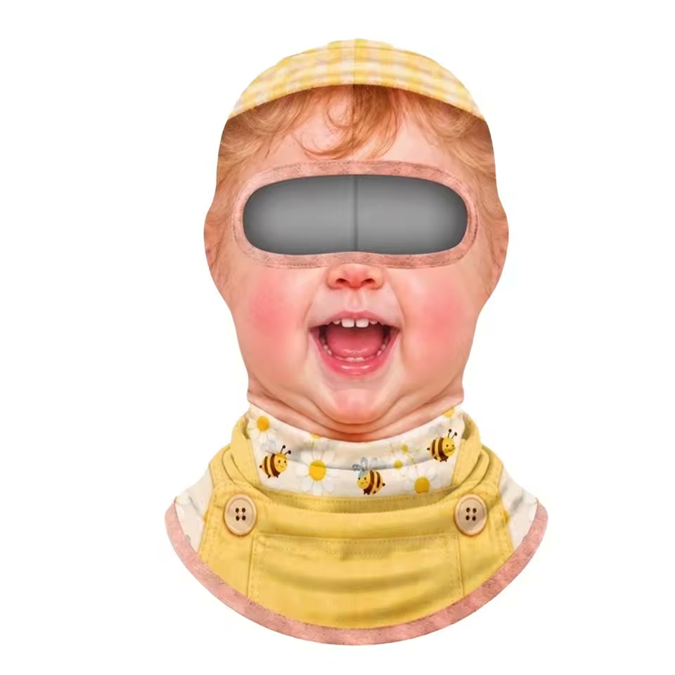 Laughing baby with a yellow hat and bee-print collar — printed fabric mask only